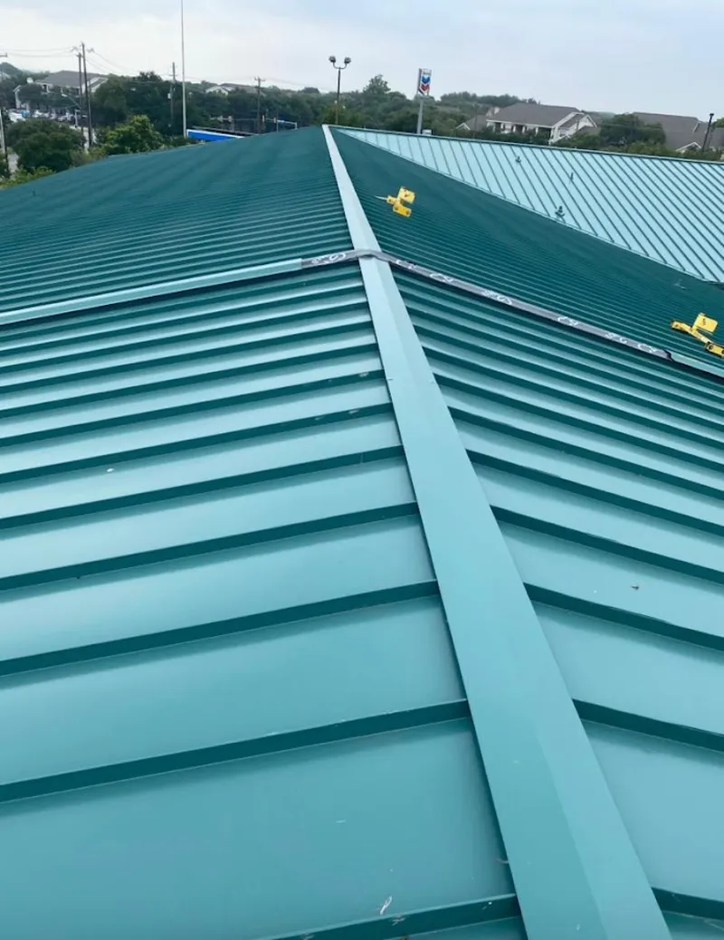 Green commercial metal roof ridge and valley for Metal Roof Repair in Burrillville